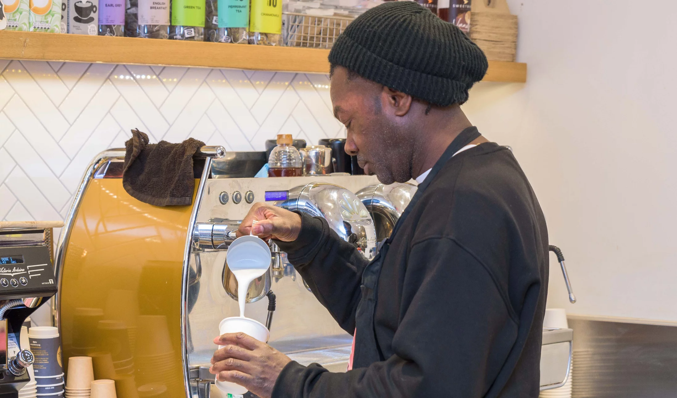 Photo of a man making coffee