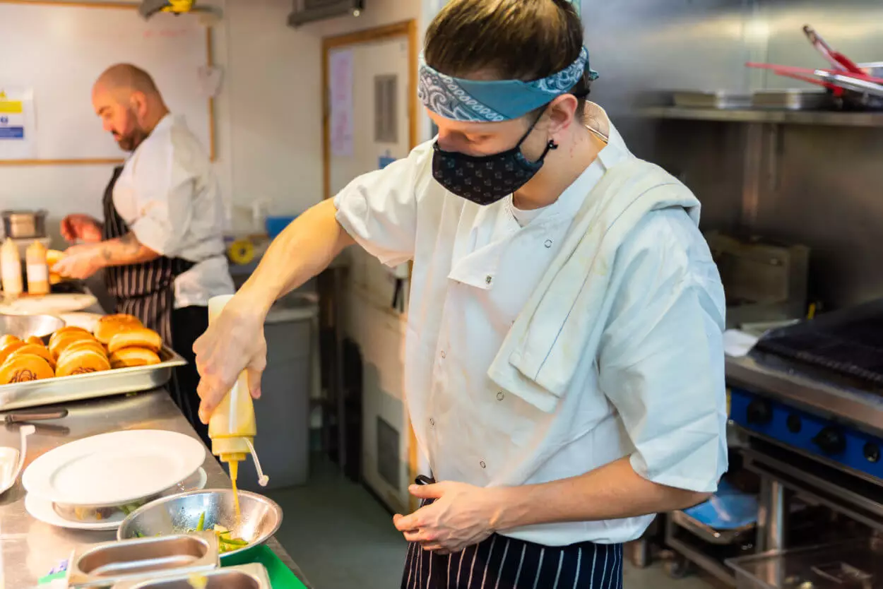 Photo of a man working in a kitchen