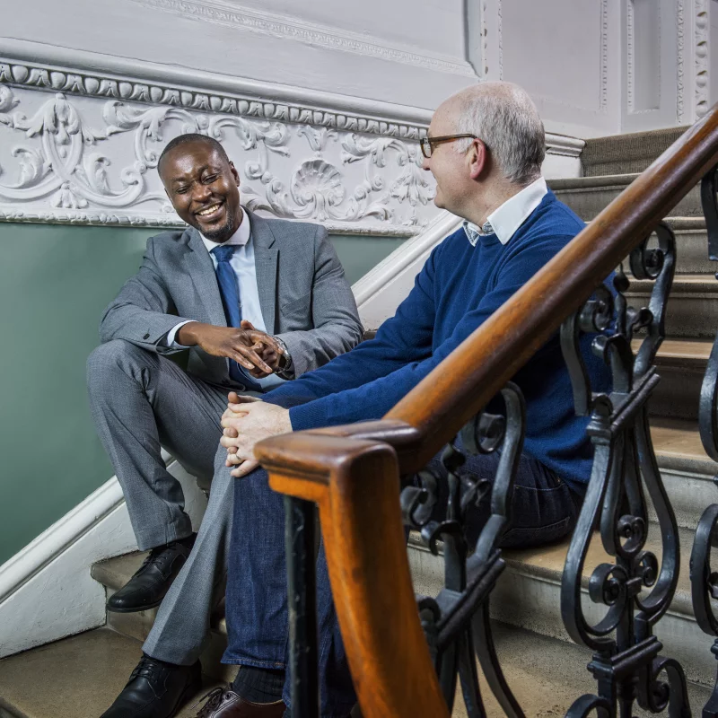 Photo of a employment participant and his mentoring chatting.