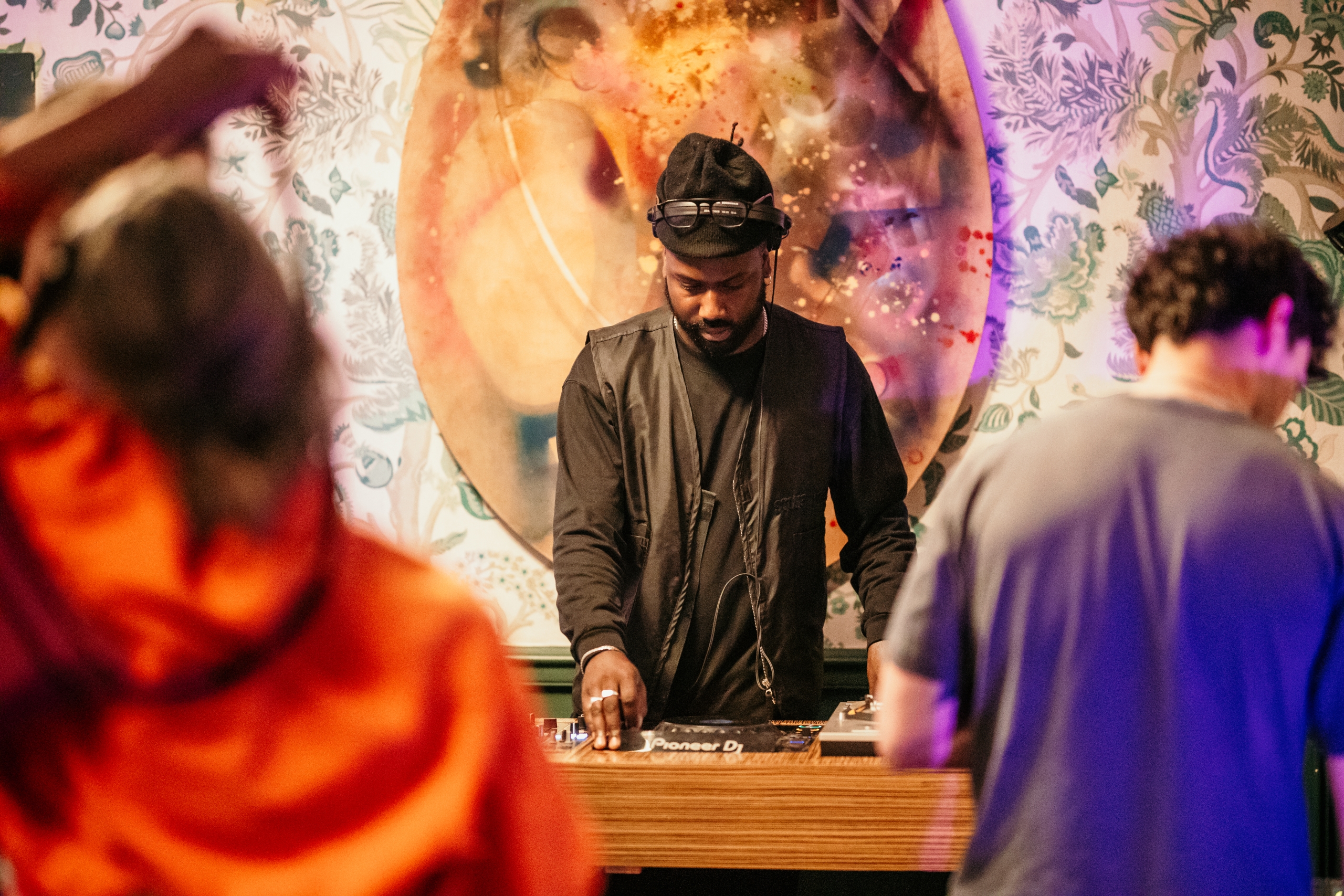 Photo of a DJ playing music in the house.